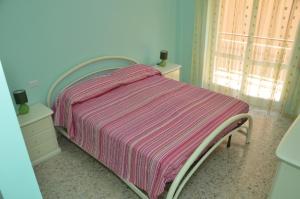 Posteľ alebo postele v izbe v ubytovaní Appartamento San Giulio