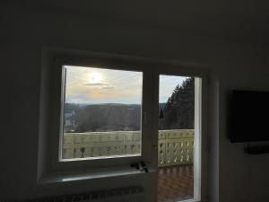 a window in a room with a view at Meli's Zirbenbett Ferienappartment in Bernstein