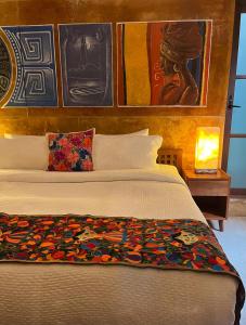Hotel "Ala Residencias"客房内的一张或多张床位