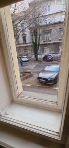 a view of a car through a window at Noble Studio Apartments in Zagreb
