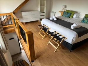 a bedroom with a large bed and a staircase at NB Mountain aparts El Chalten in El Chalten