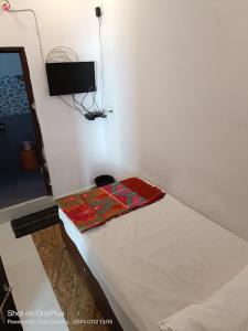 a room with a bed in a room at Durga Pride in Kurnool