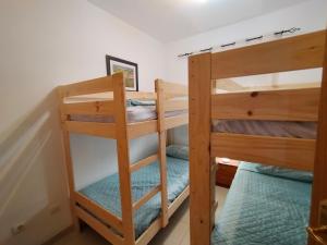 Ein Bett oder Betten in einem Zimmer der Unterkunft ACV - Vistamar II-1ª Linea Planta 9 Sur