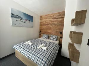 Postel nebo postele na pokoji v ubytování Apartmány Svatý Mikuláš