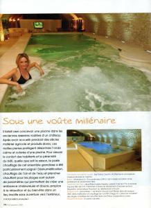 a magazine article with a woman in a swimming pool at Château de Vault de Lugny in Vault-de-Lugny