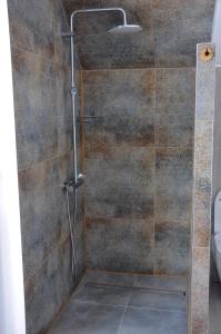 a shower with a glass door in a bathroom at DOM WITA I MAŁGOSI in Podgórzyn