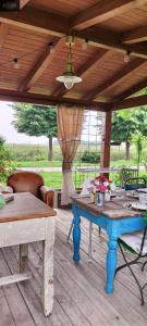 a wooden deck with a wooden table and chairs at B&B Giarola 25.2 in Cittanova