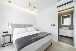 a bedroom with a large bed and a bathroom at La Porta 2, seaview apartment in the center in Cavtat
