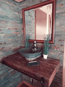a bathroom with a bowl sink and a mirror at Sonnhof in Radstadt