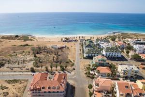 an aerial view of a beach with houses and the ocean at A Sunrise Haven with Panoramic Ocean Views in Santa Maria