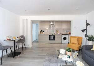 a living room with a couch and a table at The White House By Select SA in Reading