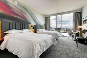 Postel nebo postele na pokoji v ubytování Hilton University of Houston