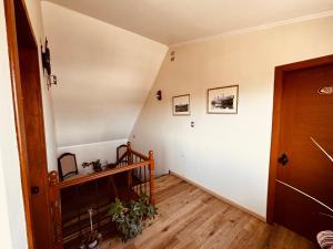 an empty hallway with a staircase and a door at Hotel Casona Los Colonos in Valdivia