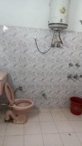 a bathroom with a pink toilet in a room at Zaranka Camps in Hisār