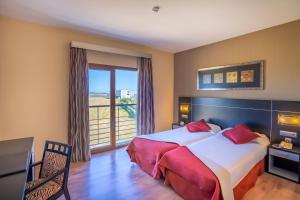 Postel nebo postele na pokoji v ubytování Hotel Andalussia