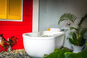 A bathroom at Castara Cottage by Hello Mello