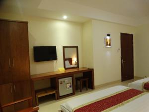 Postel nebo postele na pokoji v ubytování Hoa Vinh Hotel