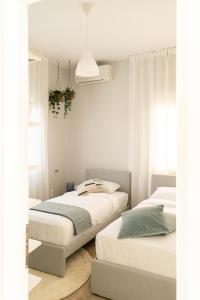 Ліжко або ліжка в номері Casa 8 - Two Bedroom House in Patras