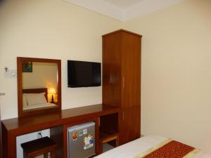 TV a/nebo společenská místnost v ubytování Hoa Vinh Hotel