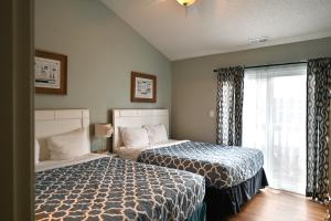a bedroom with two beds and a window at Spacious Home by the Beach 2# in Myrtle Beach