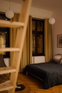 a bedroom with a bed and a window at Art Apartment Bydgoszcz in Bydgoszcz