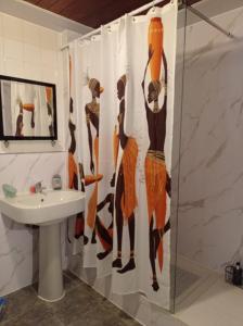 a shower curtain in a bathroom with a sink at Shepherds Spacious House 4-Beds in Romford