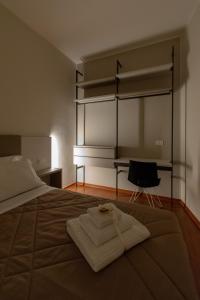 Un pat sau paturi într-o cameră la B&B Il Mercantello