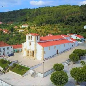 an aerial view of a large white building with a red roof at Casa da Celeste-AL in Areias