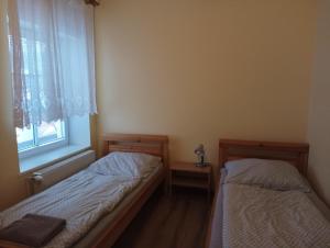 Uma cama ou camas num quarto em Hostinec Peterka