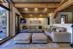 a living room with a couch and two couches at Chalet Green Forest in Chamonix-Mont-Blanc