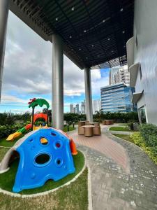 a childs play area in a building with a playground at Makati Staycation by Marco - SMDC Lush in Manila