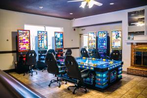 a gaming room with a bunch of pinball machines at Inn at York in York +37 photos