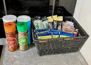 a basket filled with food and spices on a counter at 2 bed Luton town centre flat in Luton