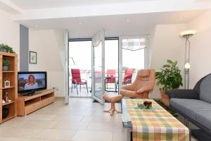 TV a/nebo společenská místnost v ubytování Residenz am Hafen
