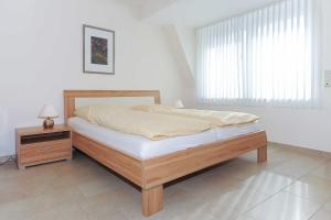 Postel nebo postele na pokoji v ubytování Residenz am Hafen