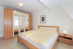 Postel nebo postele na pokoji v ubytování Residenz am Hafen