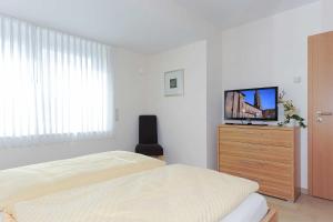 TV a/nebo společenská místnost v ubytování Residenz am Hafen