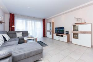 TV a/nebo společenská místnost v ubytování Residenz am Hafen
