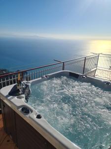 a hot tub on the deck of a cruise ship at Villa il Dolce Tramonto in Furore