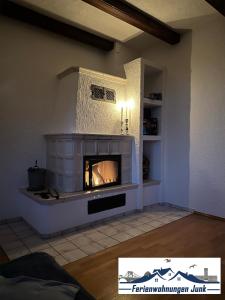 a living room with a fireplace in the wall at 98qm Wohnung im Villenviertel - Voll ausgestattet mit Balkon und Kamin - WLAN gratis in Wilhelmshaven