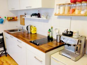 a kitchen with a sink and a stove top oven at Cityhouse Nauwies in Saarbrücken