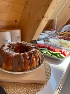 a bundt cake sitting on top of a table at Vidis Chalet Hotel in Theth