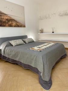 En eller flere senge i et værelse på Casa Marconi duplex avec terrasse