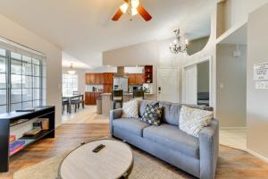 a living room with a couch and a table at Pet-Friendly Condo with Pool about 7 Mi to Dtwn Chandler in Chandler