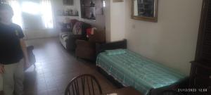 a living room with a couch and a bed in it at Alquiler Temporada Casa 2 dormitorios para 6 personas in Mar del Plata