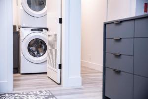 a laundry room with a washer and dryer at Revelstoke Marvel - Two Bedroom with Hot Tub in Revelstoke