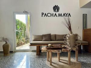 a living room with a couch and a table at Pachamaya - Suites, Wellness & Spa, Retreats in Cancún