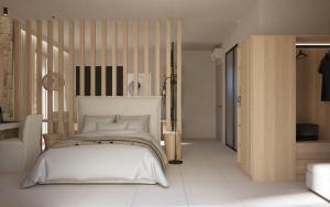 a bedroom with a white bed with a wooden headboard at Haus Platanos Apartments & Bungalows by the Sea in Vourvourou