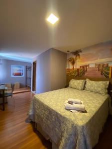 A bed or beds in a room at Serra Negra Pousada Spa