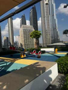 a pool in a city with tall buildings at Brand New 1BHK Near Burj Khalifa-Burj Crown tower in Dubai